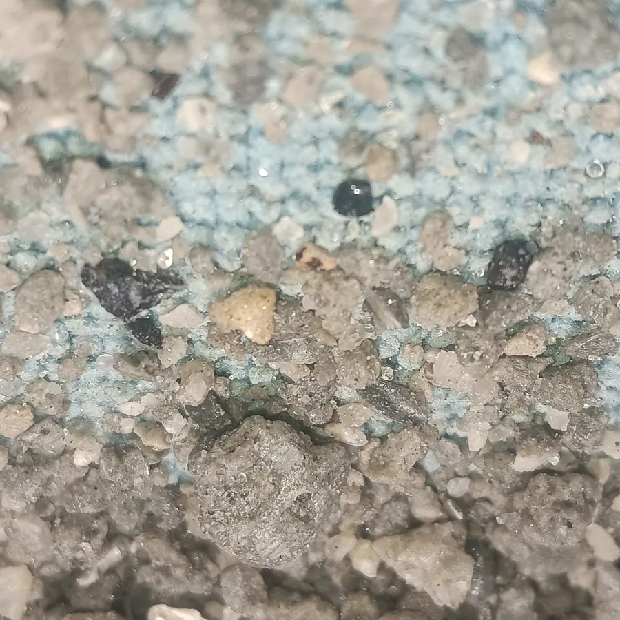 ASA Digital Art photo of crushed sediment and gravel, shown for context. No site is named, and no claim is made about what it contains. Collected lawfully over about a decade as a personal hobby, on break and lunch time while working on construction projects, with authorization to remove non-building material that would otherwise have been thrown out or buried under pavement; not from any park, preserve or public land where collecting is restricted.