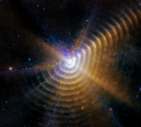 Carbon-rich dust shells around the star Wolf-Rayet 140, imaged by Webb, shown for illustration of carbon dust in space.